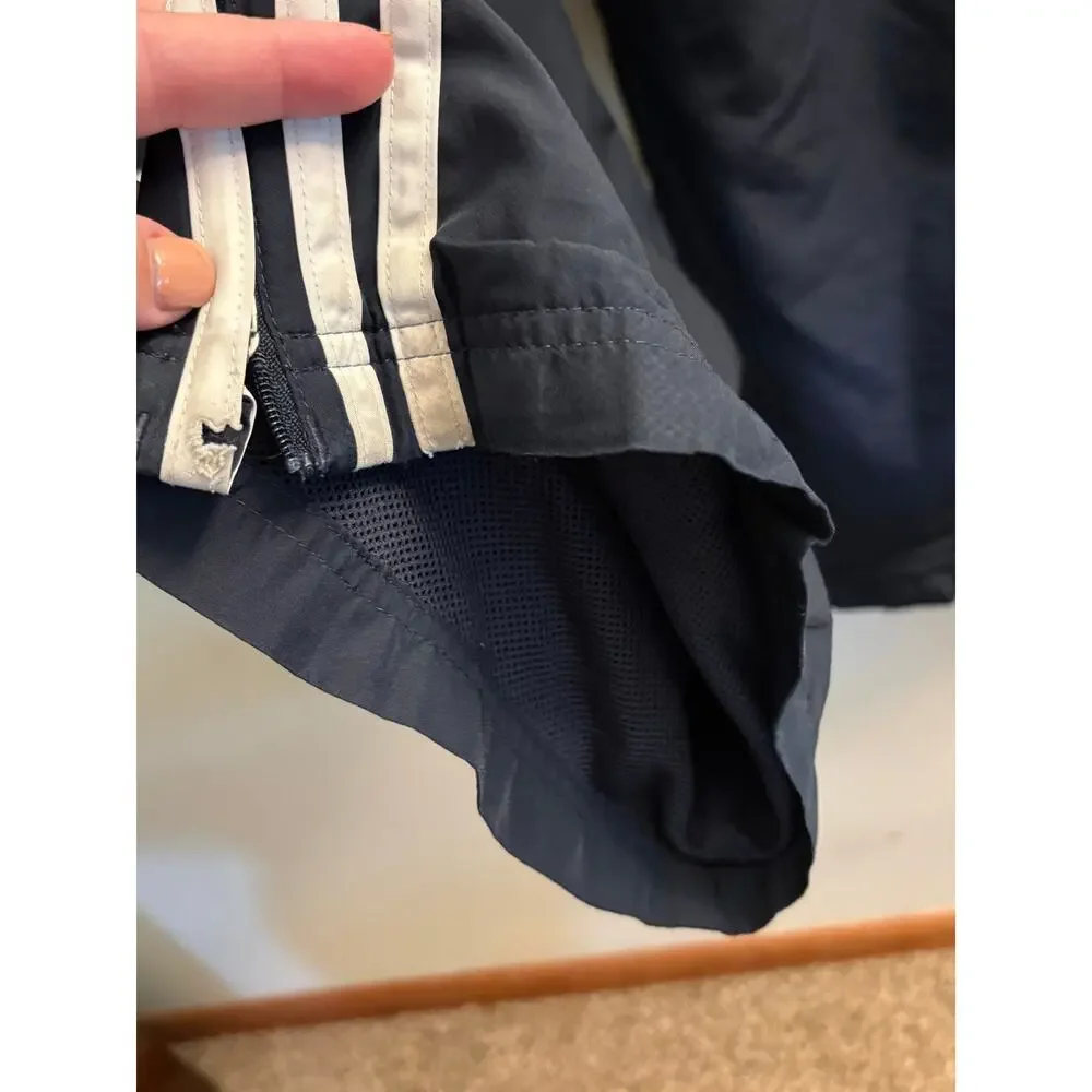 Men’s Adidas black track style pants with mesh lining